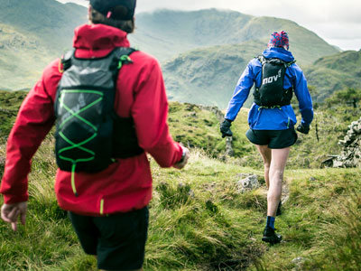 two trail runners with inov8 backpacks